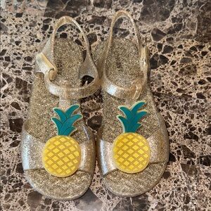 Size 10 toddler Old Navy Jelly T-Strap Sandals with pineapple decoration.